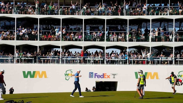 Scottie Scheffler reacts after making his par putt on the 16th hole during the final round of the 2023 WM Phoenix Open at TPC Scottsdale.